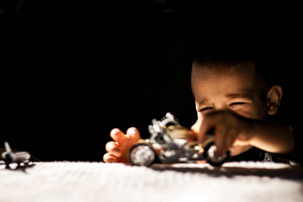 Playing with toy motorcycle
