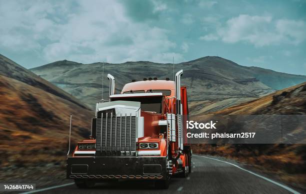 A Red Truck Runs On A Mountain Road Stock Photo - Download Image Now - Semi-Truck, Truck Driver, Truck