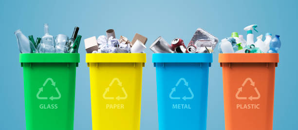 Collection of recycling bins with different types of waste stock photo