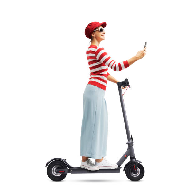 istock Woman using her smartphone and riding an e-scooter 1426842191
