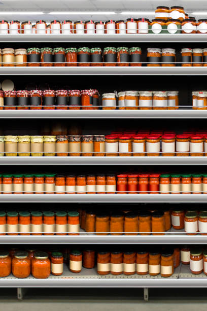 istock Salsa jars spaghetti on shelf closeup 1426843826
