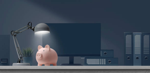 Piggy bank on a business office desktop stock photo