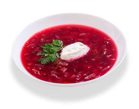 plate of traditional Ukrainian or Russian soup borscht isolated on white background