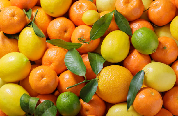 istock fresh citrus fruits as background, top view 1426845955