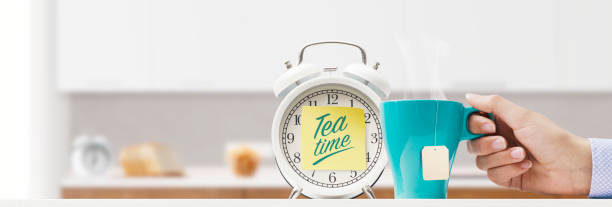 istock Woman having tea in the kitchen 1426848576