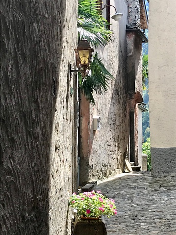 Switzerland - canton of Ticino - Village of Intragna - Centovalli - alley in the village. Intragna is best known for the bell tower of the church of San Gottardo, the highest in Ticino with its 65 meters.