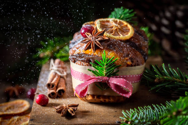 istock Powdered sugar falling on gingerbread cake with orange for Christmas 1426863689