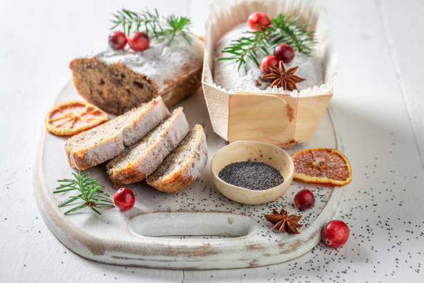 istock Poppy seed cake ornamented with spruce for Christmas 1426863909
