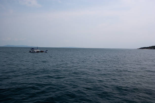 istock Sea landscape view with mountain in background, blue sky and white cloud while heading to Koh Lan Island, Pattaya, Chonburi, Thailand 1426865922