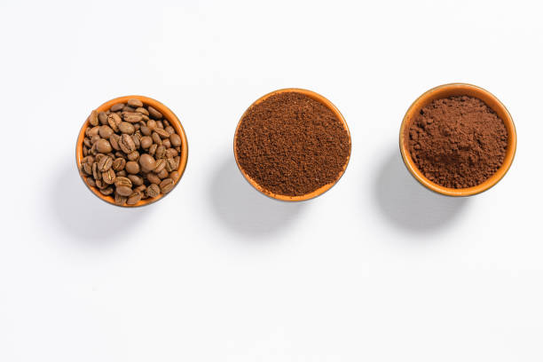 istock Three cups of coffee beans, ground coffee and cocoa for comparison. 1426874949