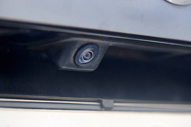 istock Luxury car rear view camera for parking assistance selective focus close up with sunflare and copyspace. Concept of safety car driving while parking process. Assist device equipment in modern cars. 1426878906
