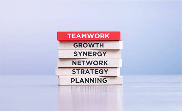 istock Teamwork Related Words Written Wood Blocks Sitting on Wood Surface in Front a Defocused Background 1426879140