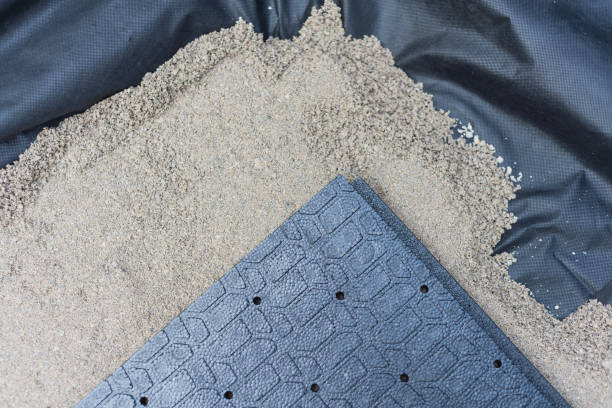 istock Landscape fabric, leveling sand and polypropylene paver base panel of walkway patio installation in Texas, USA 1426886950