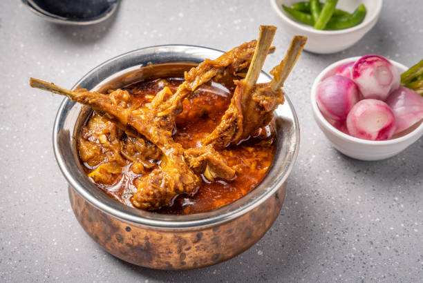 istock home cooked mutton gravy or mutton curry  with roti and onion salad 1426888010