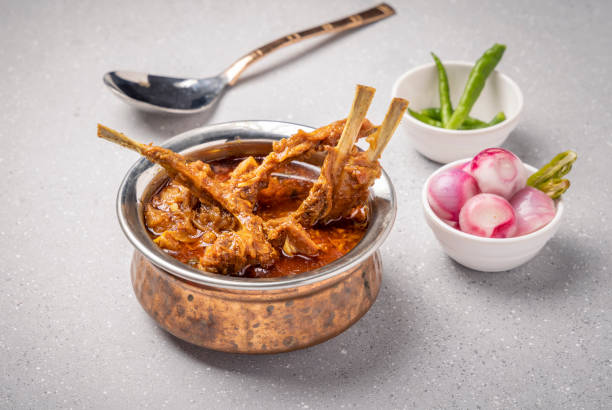 istock home cooked mutton gravy or mutton curry  with roti and onion salad 1426888081