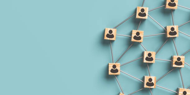 istock Wooden blocks with people icon on a blue background. 1426889617