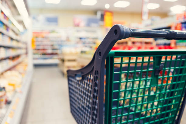 Empty grocery cart in the store. stock photo