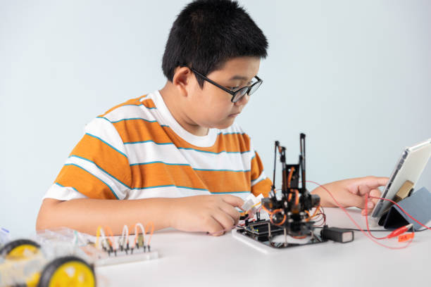 istock Children creating robot cars using a digital tablet at home 1426891461