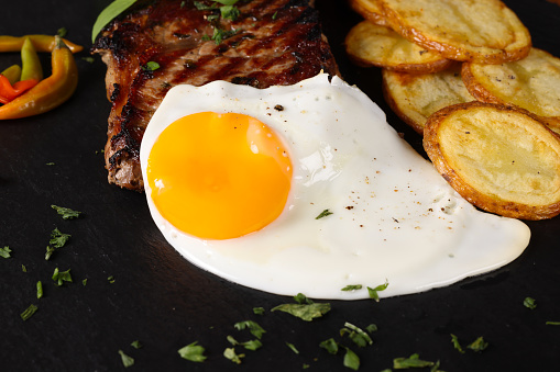 Fried Egg On The Bread On The White Dish and coffee