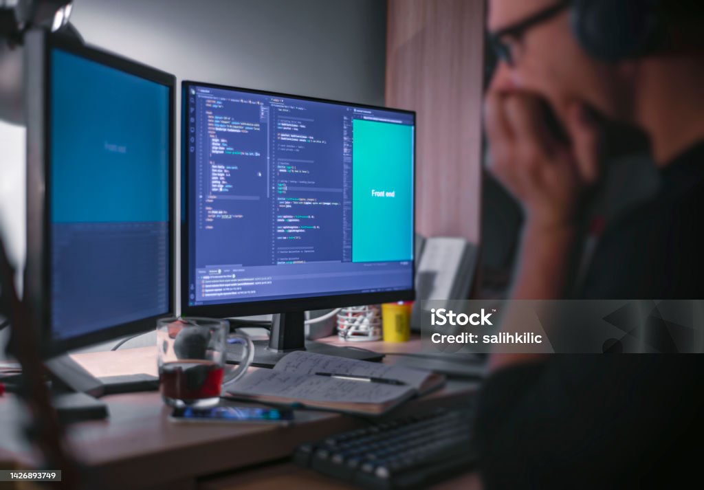 A Male Front End Developer Thinking While Coding In The Night Time ...