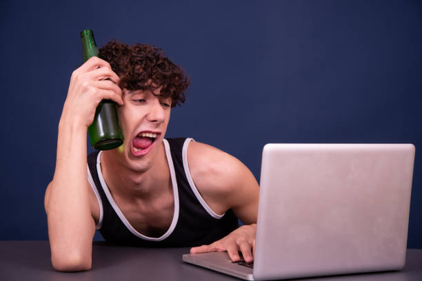 A man watches an adult video online. Funny man perv stock pictures, royalty-free photos & images