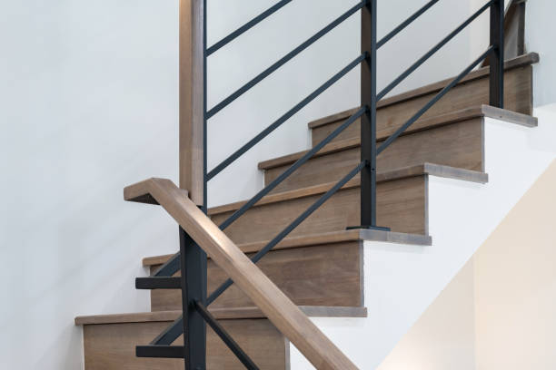 wooden modern stairs and railing stock photo