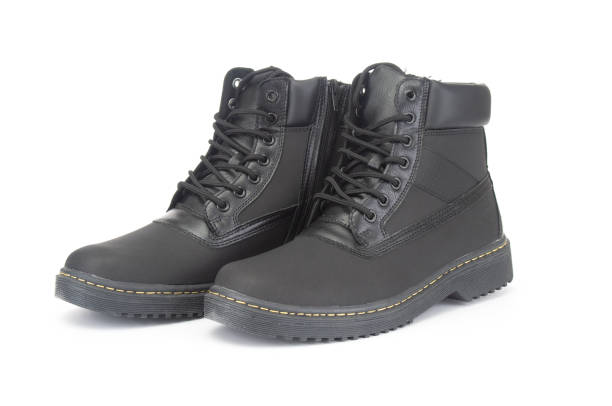 istock Pair of new winter boots close up on white background 1426899718