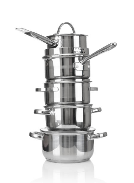 istock Stack of stainless saucepans isolated on white background 1426901231