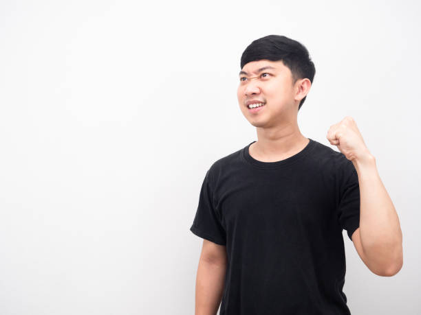 istock Asian man show fist up confident face looking at copy space 1426902531