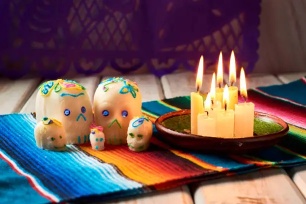 Photo of Sugar skulls or calaveritas in altar of the dead. Mexican tradition dia de muertos.