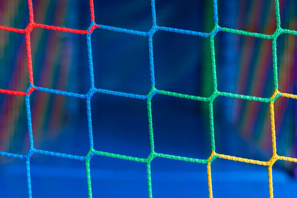 Front view of a soccer net on a blue sky background.Could be a useful element in a soccer composition.This image contains copy space.This is a detailed 3d rendering.