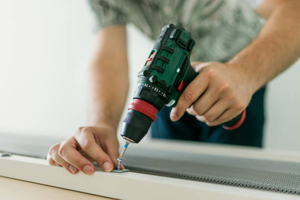 close up of man doing renovation work at home - screwdriver imagens e fotografias de stock