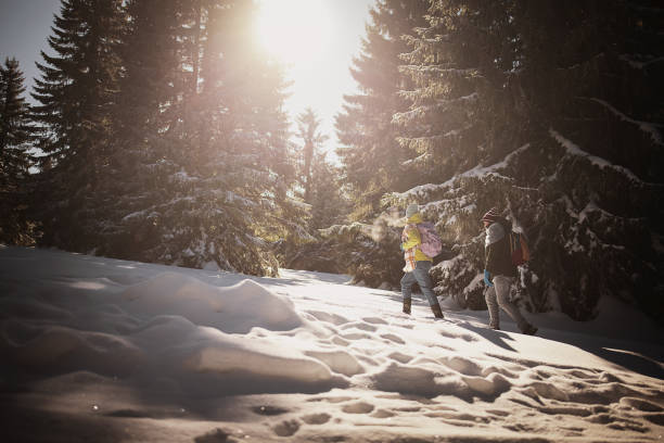 istock Hiking through snow on mountain 1426918342