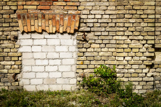 istock Old abandoned wall with bricked up windows 1426918424
