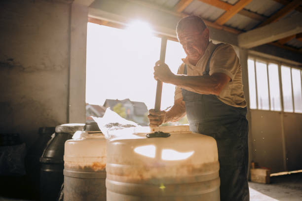 istock Mixing the fruit mash for moonshine 1426918538