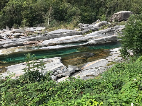 Switzerland - Canton of Ticino - Valle Verzasca- Village of Lavertezzo. The name of the village itself is best known for the Ponte dei Salti with two arches in Val Verzasca, or erroneously called also Roman bridge, privileged romantic destination for bathers and diving enthusiasts in the green waters of the river.