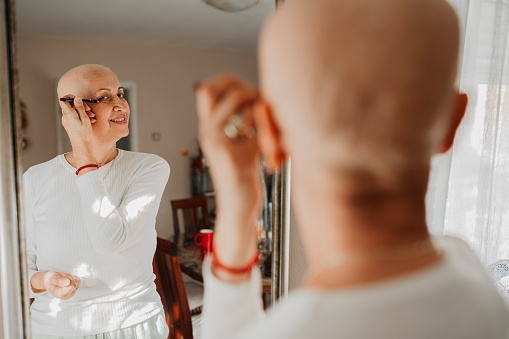A woman, a cancer fighter and a mirror