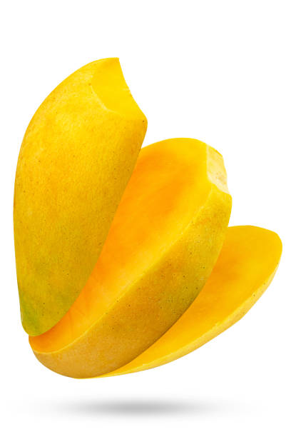 istock Falling whole and sliced yellow mango isolated on white background 1426928044