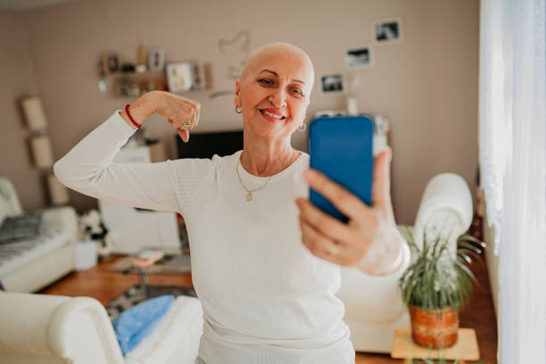 Woman with headscarf fighting cancer stock photo
