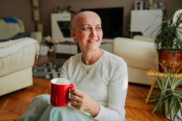 Woman who beat cancer enjoys coffee stock photo