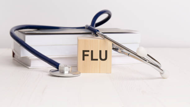istock wooden block form the text FLU - with stethoscope, notepad. medical concept 1426939162