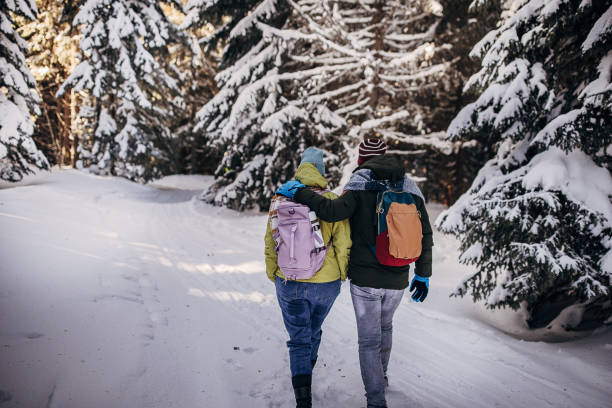 istock Father and daughter hiking on mountain 1426941098