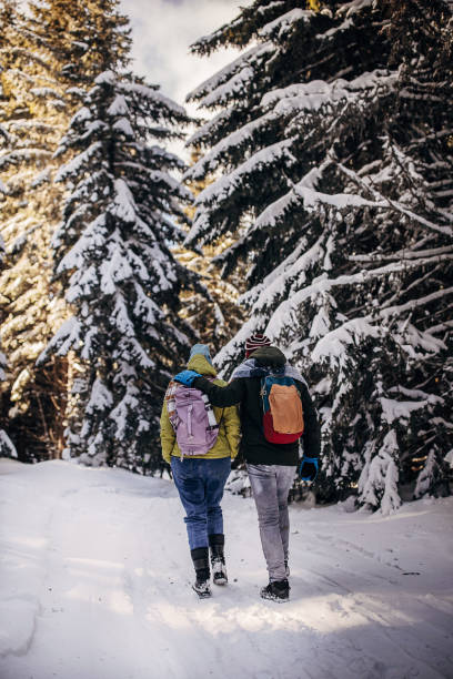 istock Father and daughter hiking on mountain 1426941127