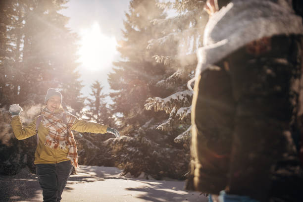 istock Father and daughter having fun with snow 1426942299
