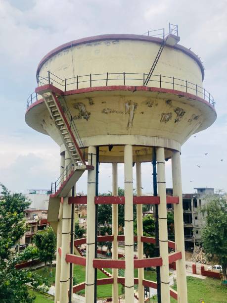 Maharashtra,India,December,22,2005:Medium size overhead storage tank supported by pillars for drinking water supply at rural village ,Maharashtra,India,Asia