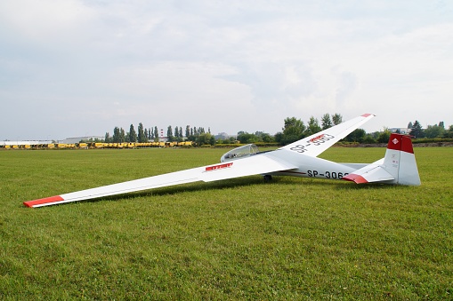 Polish two-seater SZD-9 Bocian glider standing on the apron in Płock, Poland