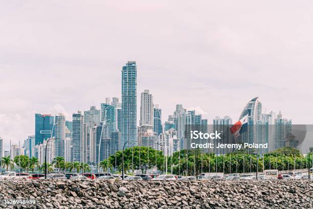 New Panama City Skyline Panama From The Harbor With Panamanian Flag In The Foreground Stock Photo - Download Image Now