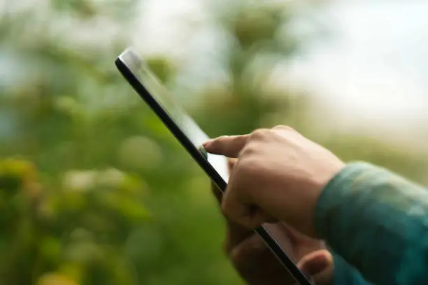 Photo of Farmer using digital tablet