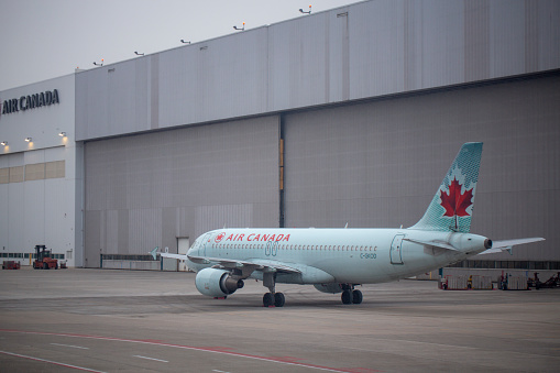 Air Canada Airbus A320-214 aircraft with registration C-GKOD parked at hangar at Toronto Pearson International Airport in April 2022.