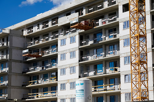 Warsaw, Poland - September 2, 2022: A new, multi-storey residential building is being built on the construction site in the Goclaw estate in the Praga Poludnie district